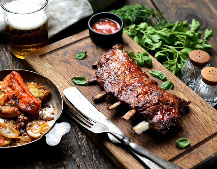 grilled ribs on a cutting board rustic style